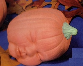 S1485 Laying Pumpkin Baby